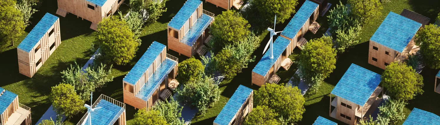 Klimaneutralität Projekte: bewegliche Containerhäuser aus Holz mit Solarmodulen auf dem Dach.